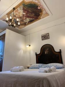 En eller flere senge i et værelse på Sa domu de don Ninnu bed breakfast Spa