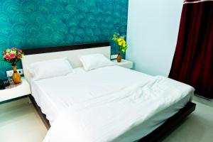 Postel nebo postele na pokoji v ubytování Jagdambey Hotel