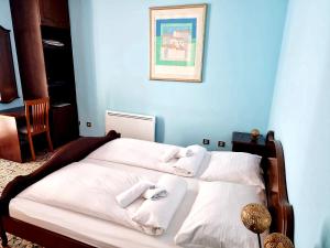 Postel nebo postele na pokoji v ubytování VILLA BISER
