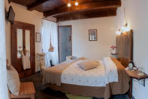 Ένα ή περισσότερα κρεβάτια σε δωμάτιο στο Il Tomolo