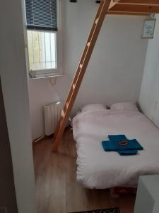 Posteľ alebo postele v izbe v ubytovaní Cosy Studio in Montmartre
