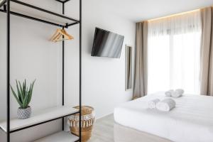 Postel nebo postele na pokoji v ubytování Amalthia Luxury Suites