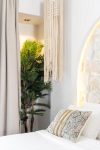 Postel nebo postele na pokoji v ubytování Amalthia Luxury Suites