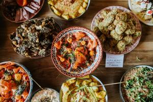 a table topped with lots of different types of food at Viscri 32 - White Barn and Blue House in Viscri