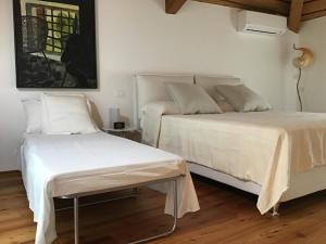 Katil atau katil-katil dalam bilik di La Foresteria di Villa Gorgo