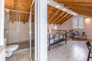 a bathroom with a shower and a bed in a room at Luxury Apartments A&A-old town in Split +34 photos