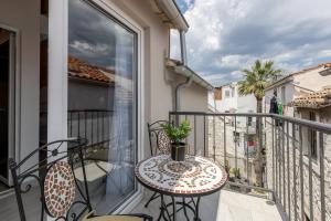 a balcony with a table and chairs on a balcony at Luxury Apartments A&A-old town in Split