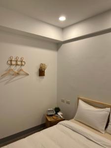 Giường trong phòng chung tại 宸村民宿