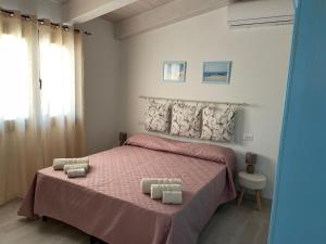 Ένα ή περισσότερα κρεβάτια σε δωμάτιο στο PRIMA LUCE