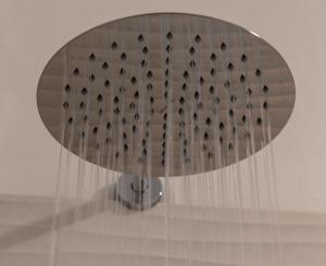 a glass table with a bunch of holes in it at Hotel Acquamarina in Portoferraio +37 photos