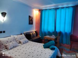 Postel nebo postele na pokoji v ubytování RIAD Camping ATLAS
