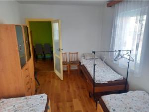 a room with two bunk beds and a hallway at Apartmán U jelena in Zvole