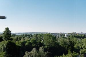 a view of the city from the tower at Нова гарна та чиста, квартира біля парку та озера in Ternopil
