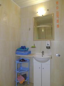 a bathroom with a sink and a mirror at Gdzie diabeł mówi dobranoc in Pisz +77 photos