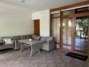 a living room with a couch and a table at Santa Marina Apartment 503 in Sozopol