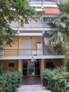 an external view of a building with a balcony at Cozy and comfortable in Piraeus