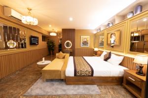 a bedroom with a large bed in a room at La Fleur Premium Central Apartment Hotel in Da Lat