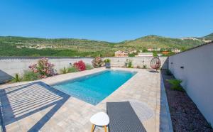 a swimming pool in the backyard of a house at Villa Carpe Diem - with private pool in Mostar