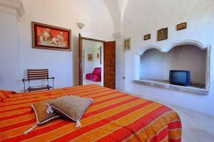 A bed or beds in a room at Masseria Bianca