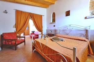 A bed or beds in a room at Masseria Bianca