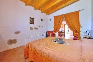 A bed or beds in a room at Masseria Bianca
