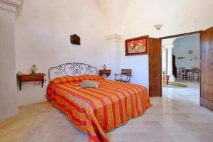 A bed or beds in a room at Masseria Bianca