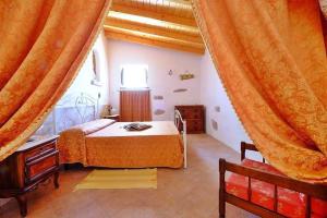 A bed or beds in a room at Masseria Bianca
