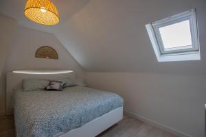Säng eller sängar i ett rum på Faubourg des voyageurs N°7