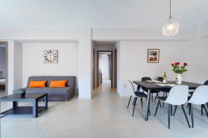 a living room with a table and a couch at Zoi's house in Limenas