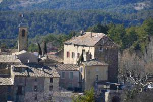 an old village with a church and a tower at Château de Rosans in Rosans