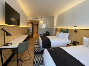 Postel nebo postele na pokoji v ubytování Met Hotel
