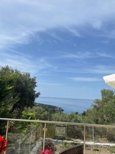 a view of the ocean from a balcony at Anthi's House in Vlachopoulátika +13 photos
