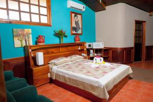 En eller flere senge i et værelse på Hotel Mar de Luz