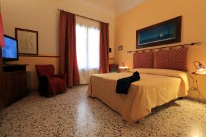 เตียงในห้องที่ Sicilia Ovest - Domus Mariae Charming Apartments with Balcony