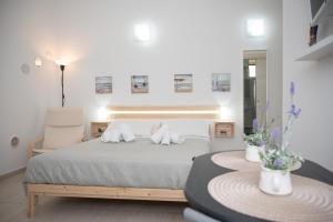 a bedroom with a bed and a chair and a table at Sweet Home in Termoli