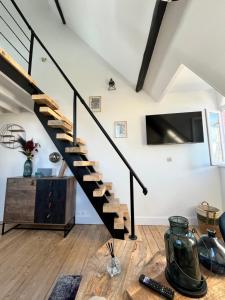 Μια τηλεόραση ή/και κέντρο ψυχαγωγίας στο DUPLEX HYPER CENTRE - 4 pers - REFAIT A NEUF