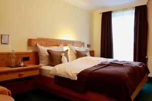 Rúm í herbergi á Hotel Kreutzer