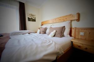 Rúm í herbergi á Hotel Kreutzer