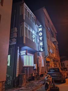 a building with a sign on the side of it at Karhal Hotel in Edirne