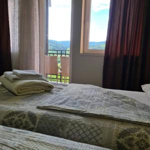 Postel nebo postele na pokoji v ubytování RA Apartmani Vrdnik