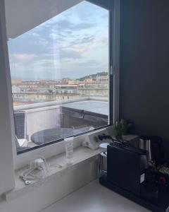 a window in a room with a view of a balcony at 18 Dante Luxury Suites in Cagliari