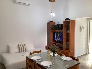 Televízia a/alebo spoločenská miestnosť v ubytovaní Landro House