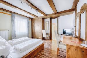 Postel nebo postele na pokoji v ubytování Hotel Garni Nuss