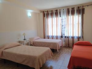 A bed or beds in a room at apartamentos la villa 3