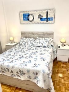 a bedroom with a bed and two night stands at Engoco in Gijón