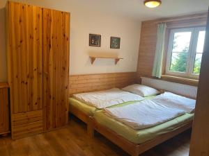 Postel nebo postele na pokoji v ubytování Alba Apartmany Železná Ruda