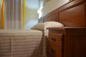 A bed or beds in a room at B&B Al Tramonto Portopalo