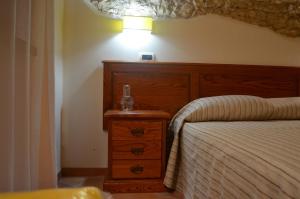 A bed or beds in a room at B&B Al Tramonto Portopalo