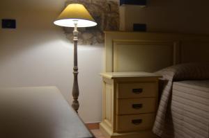 A bed or beds in a room at B&B Al Tramonto Portopalo