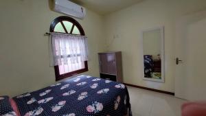 Posteľ alebo postele v izbe v ubytovaní Hostel pé da serra